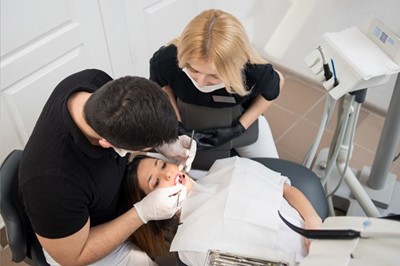 Doctor working on patient